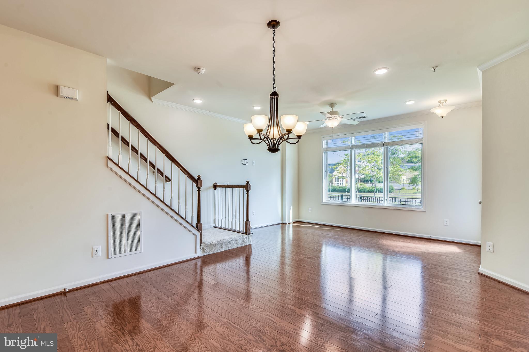 1508 Ribbon Limestone Terrace Southeast Leesburg, VA 20175 - Photo 19 of 79 a view of empty room with wooden floor and fan