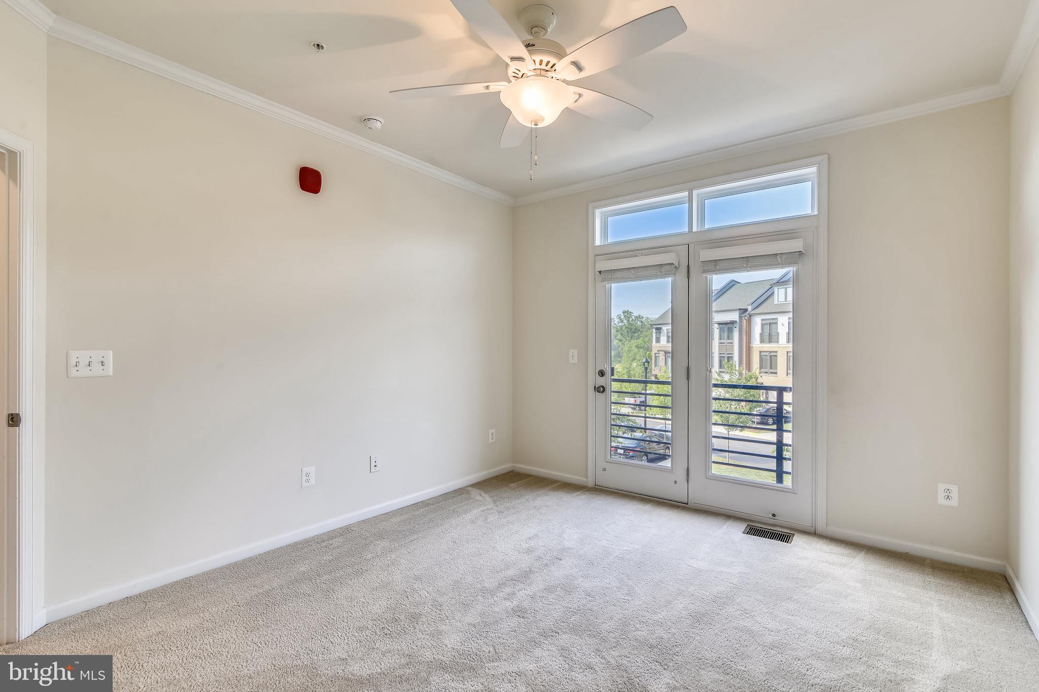 1508 Ribbon Limestone Terrace Southeast Leesburg, VA 20175 - Photo 35 of 79 an empty room with windows and ceiling fan
