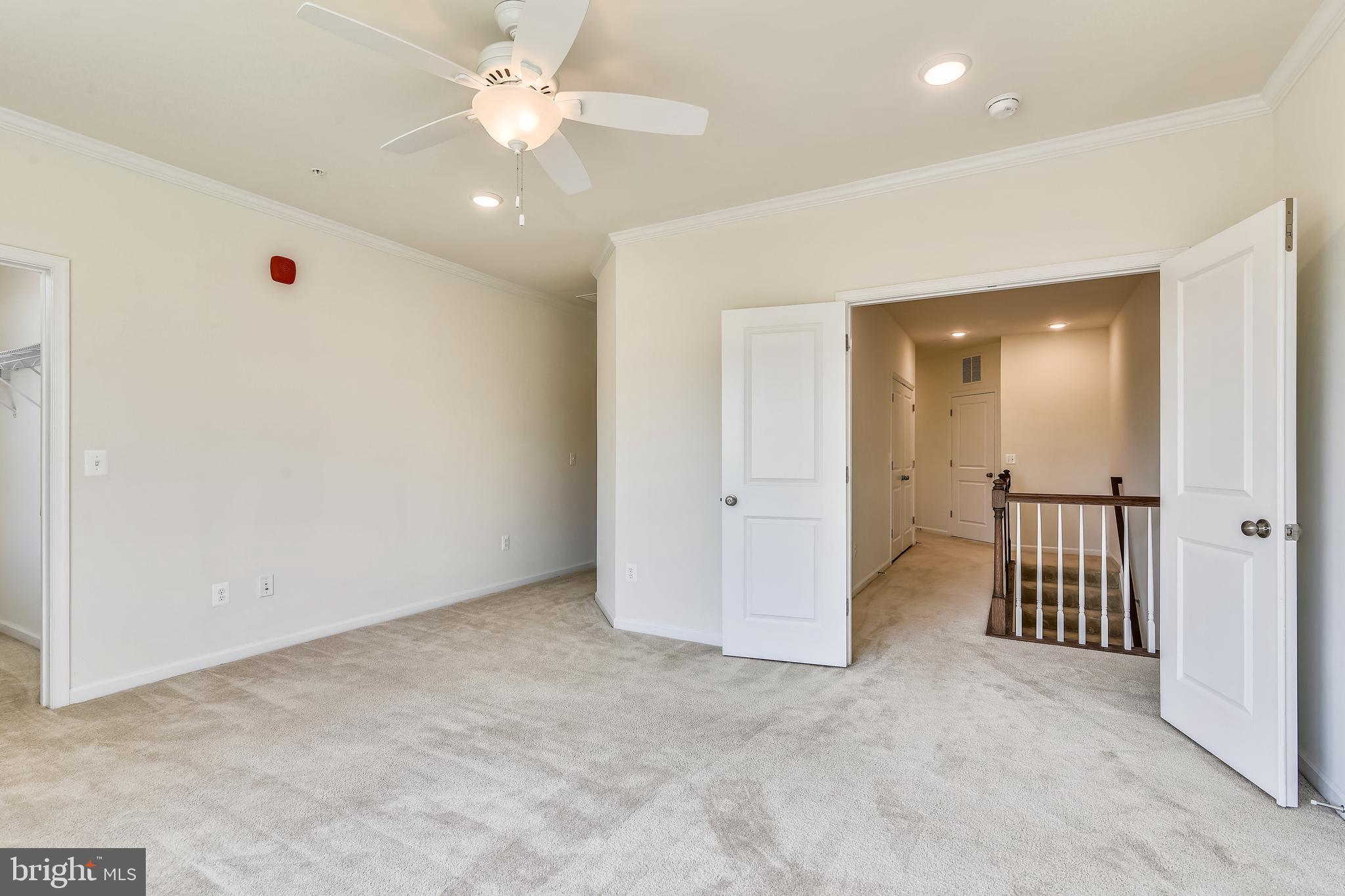 1508 Ribbon Limestone Terrace Southeast Leesburg, VA 20175 - Photo 42 of 79 an empty room with closet and a ceiling fan