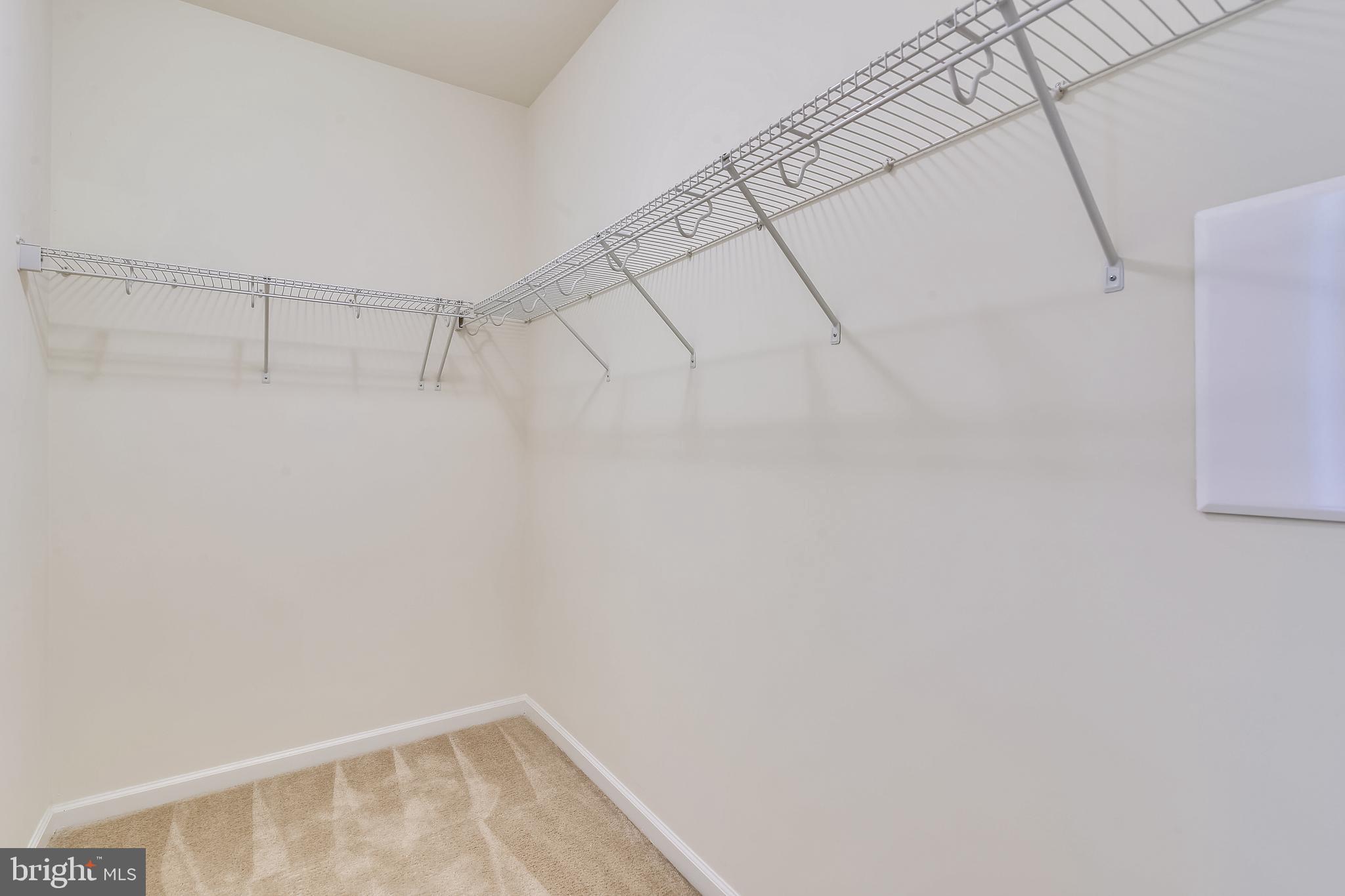 1508 Ribbon Limestone Terrace Southeast Leesburg, VA 20175 - Photo 44 of 79 a view of a room with racks on the wall