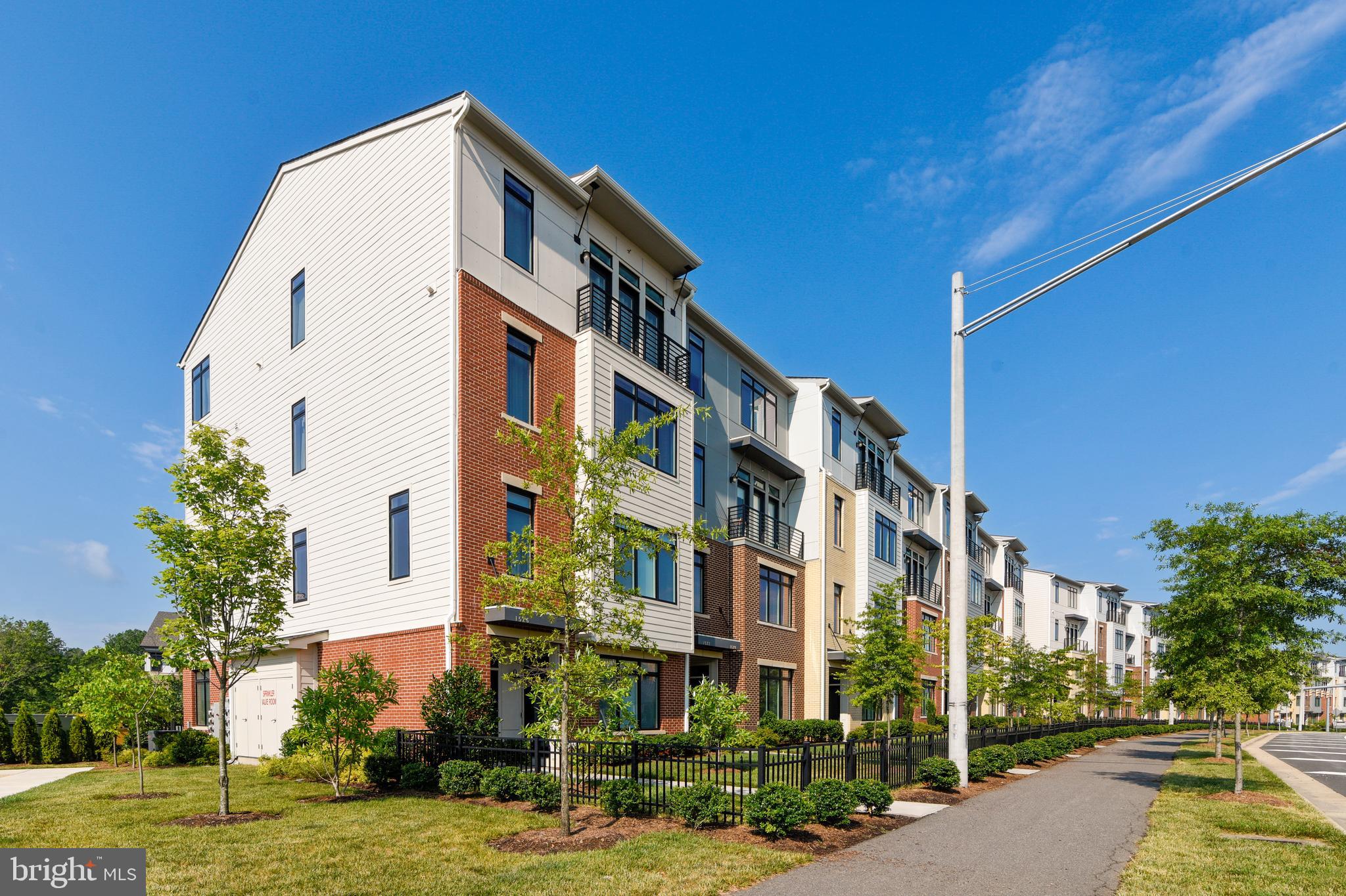 1508 Ribbon Limestone Terrace Southeast Leesburg, VA 20175 - Photo 6 of 79 a view of a tall building next to a road