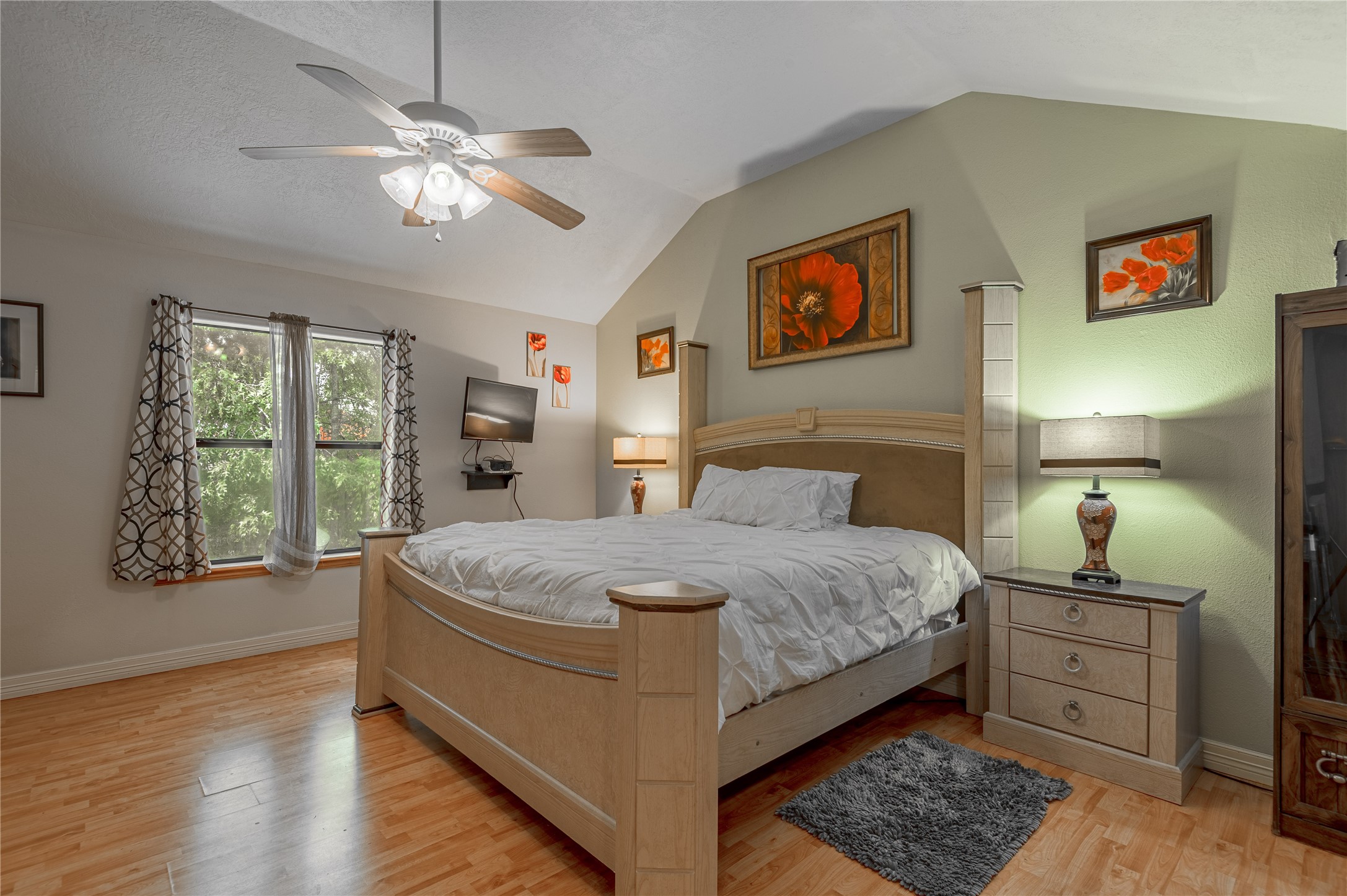 47-57 Stage Coach Road Coldspring, TX 77331 - Photo 17 of 50 a spacious bedroom with a bed and wooden floor