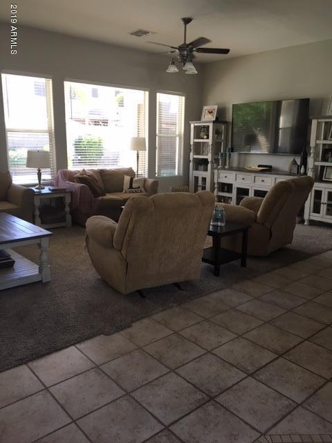 3443 East Rosa Lane Gilbert, AZ 85297 - Photo 12 of 53 a living room with furniture and a flat screen tv