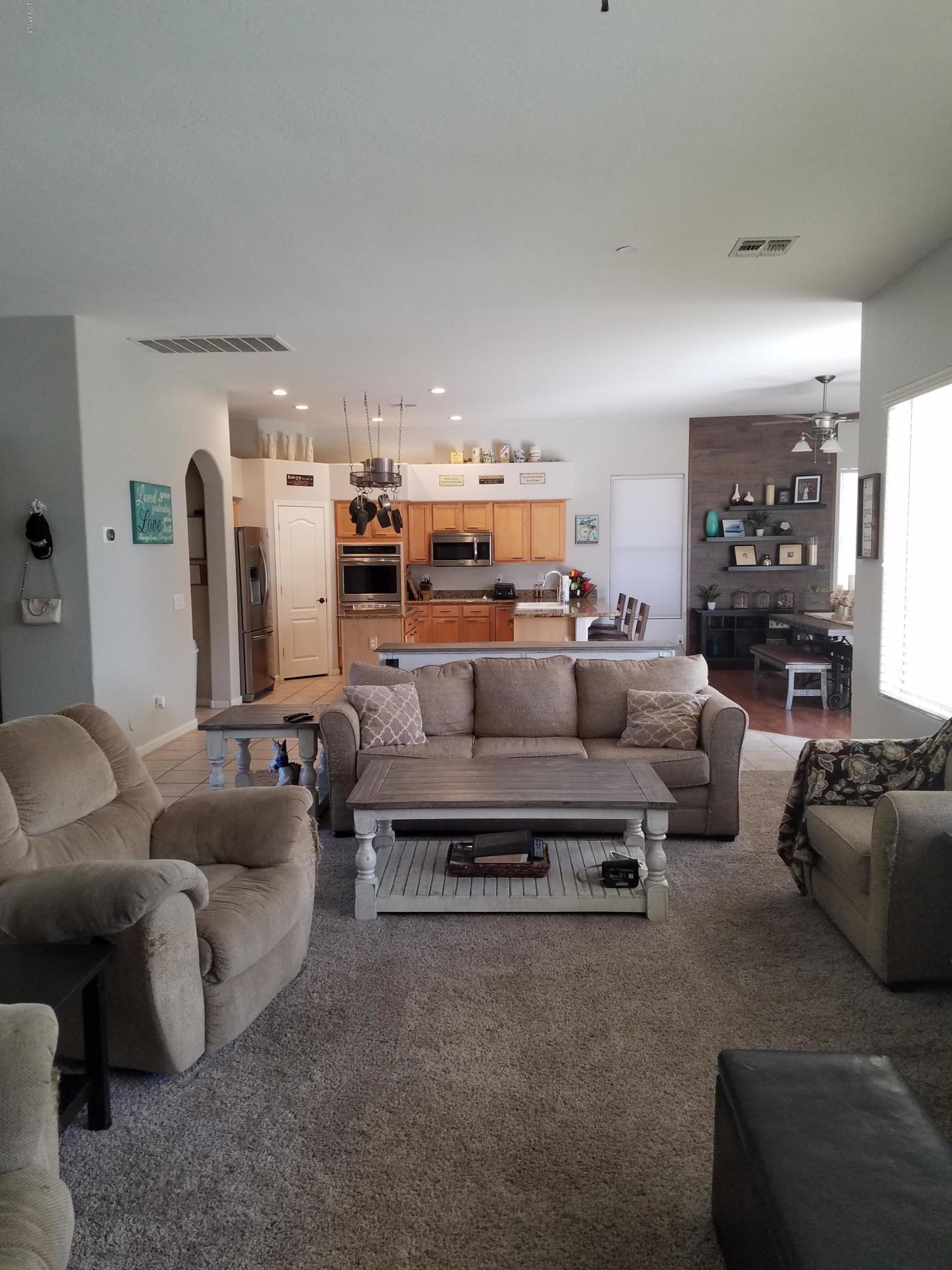 3443 East Rosa Lane Gilbert, AZ 85297 - Photo 13 of 53 a living room with furniture and a couch
