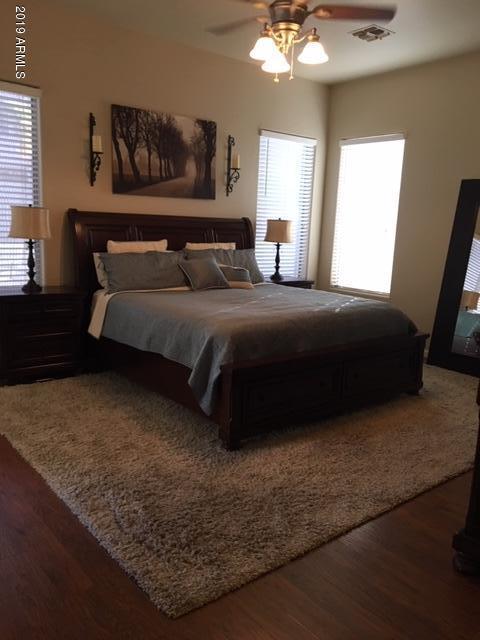 3443 East Rosa Lane Gilbert, AZ 85297 - Photo 18 of 53 a bedroom with a bed and window