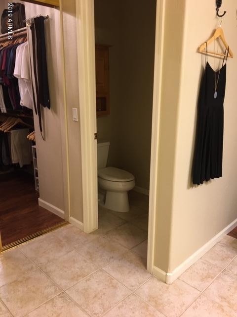 3443 East Rosa Lane Gilbert, AZ 85297 - Photo 22 of 53 a bathroom with a toilet and a tub