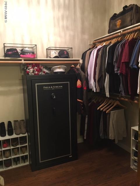 3443 East Rosa Lane Gilbert, AZ 85297 - Photo 24 of 53 a view of walk in closet with clothes and shoes