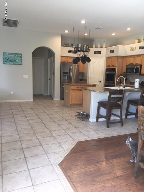 3443 East Rosa Lane Gilbert, AZ 85297 - Photo 3 of 53 a living room with kitchen