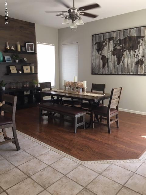 3443 East Rosa Lane Gilbert, AZ 85297 - Photo 4 of 53 a view of a dining room with furniture and chandelier