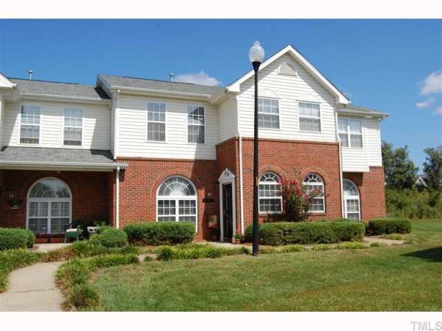 2031 Rivergate Road, Unit 107 Raleigh, NC 27614 - Photo 1 of 12 a front view of a house with a garden