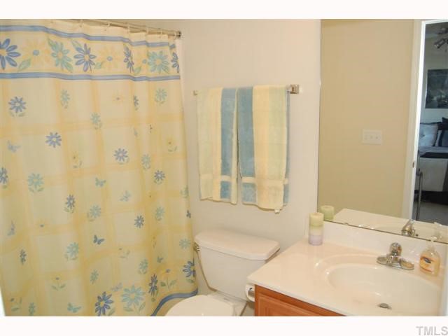 2031 Rivergate Road, Unit 107 Raleigh, NC 27614 - Photo 11 of 12 a bathroom with a sink and a mirror
