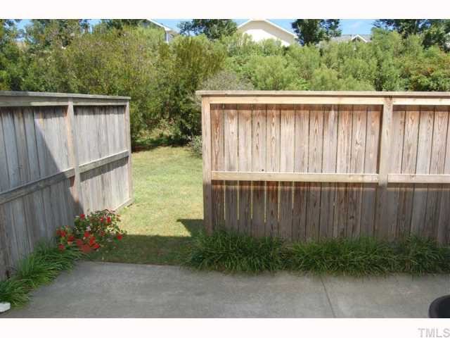 2031 Rivergate Road, Unit 107 Raleigh, NC 27614 - Photo 3 of 12 a balcony with a yard