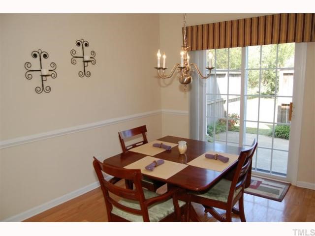 2031 Rivergate Road, Unit 107 Raleigh, NC 27614 - Photo 8 of 12 a view of a dining room with furniture window and outside view