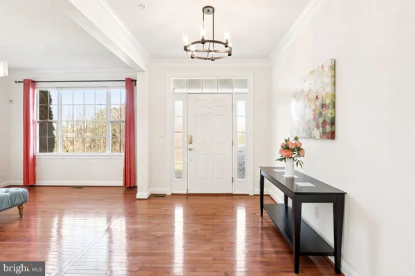 a view of livingroom with furniture wooden floor and windows