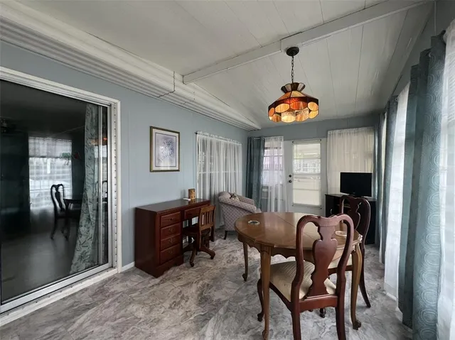 a view of a livingroom with furniture window and wooden floor