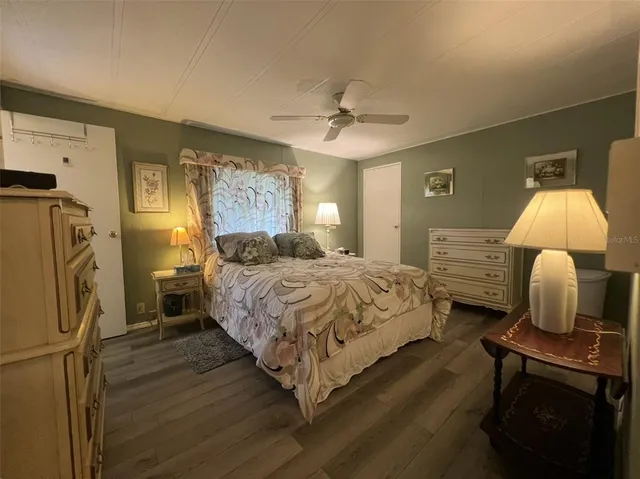 a bedroom with a bed and dresser