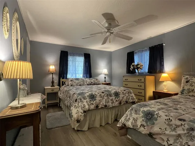 a bedroom with a bed and a dresser in it