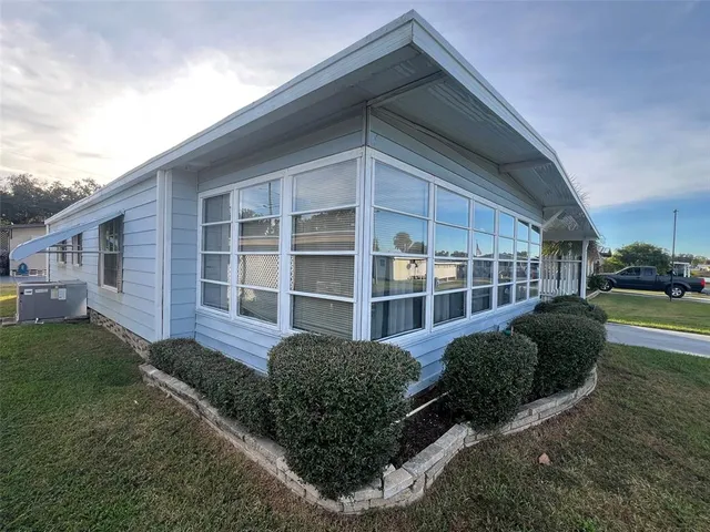 a view of multiple house with a yard