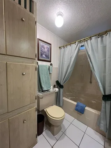 a hallway with closet and a window