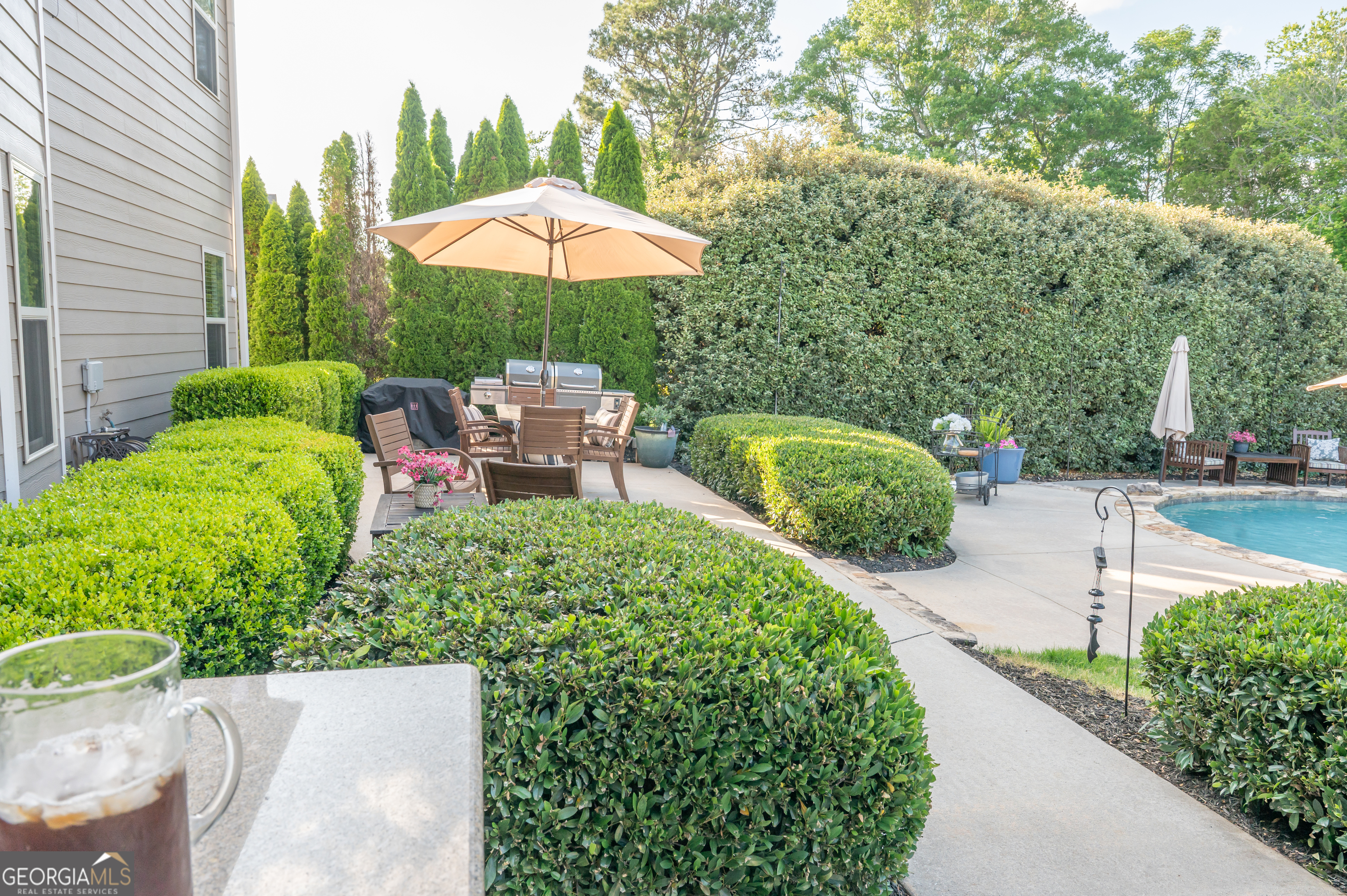 415 EAS Way Fayetteville, GA 30215 - Photo 52 of 70 a view of a backyard with sitting area and furniture