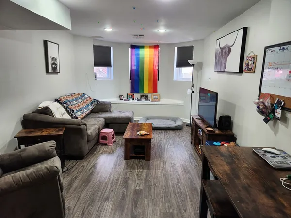 a living room with furniture and a flat screen tv