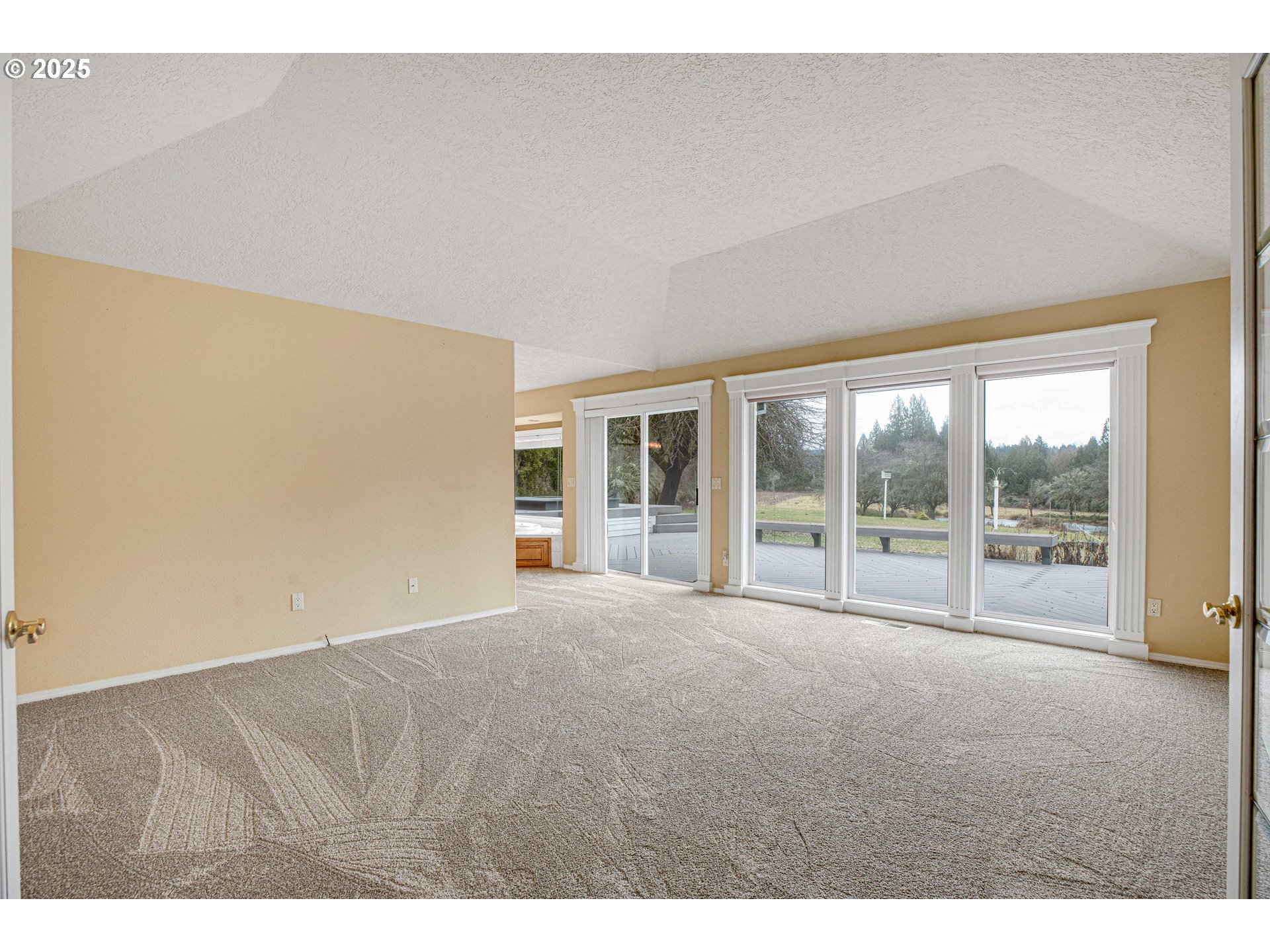 38651 Southeast Serban Road Sandy, OR 97055 - Photo 21 of 46 a view of an empty room with wooden floor and a window