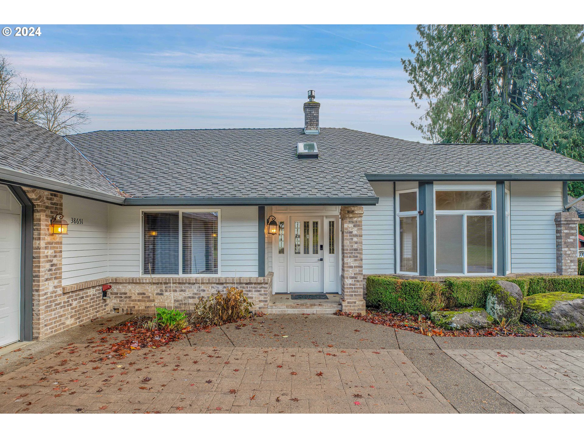 38651 Southeast Serban Road Sandy, OR 97055 - Photo 6 of 46 a front view of a house with a yard