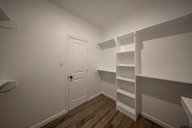 a view of an empty walk in closet