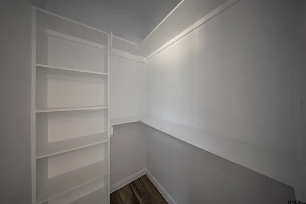 a view of an empty walk in closet