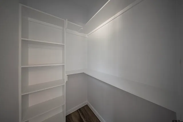 a view of an empty walk in closet