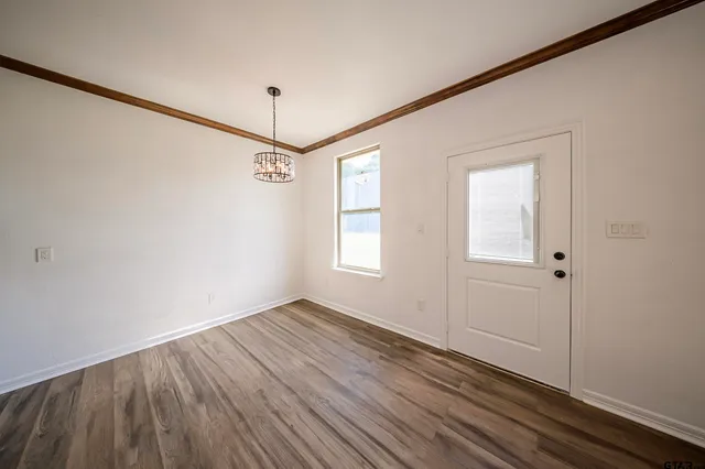 a view of a house with backyard porch and sitting area
