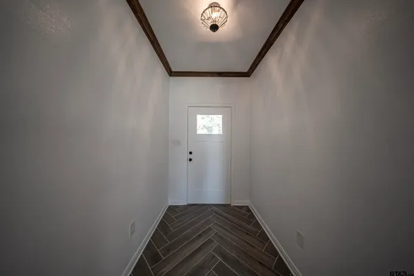a view of backyard of house with green space