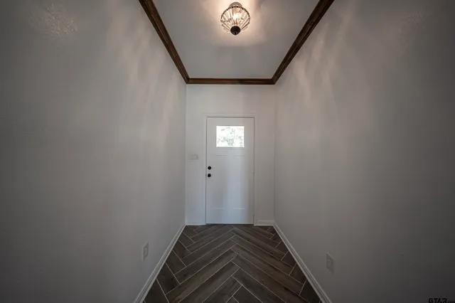 a view of backyard of house with green space