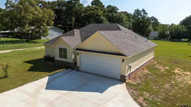 a view of a swimming pool with seating area