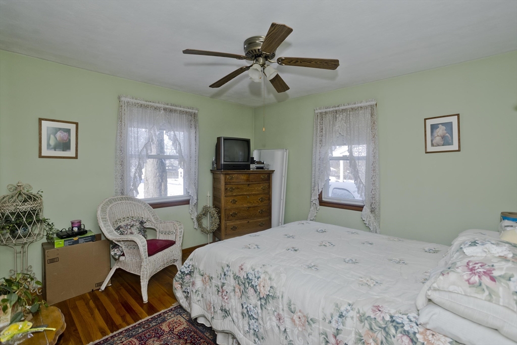 129 Cooper Street Springfield, MA 01108 - Photo 14 of 26 a bedroom with a bed and furniture