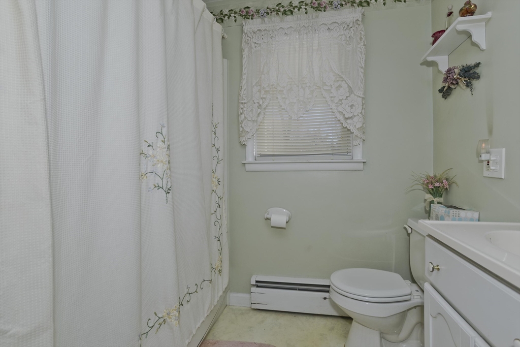 129 Cooper Street Springfield, MA 01108 - Photo 18 of 26 a bathroom with a sink a toilet and shower