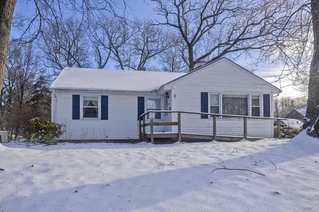 129 Cooper Street Springfield, MA 01108 - Photo 26 of 26 a house that has a tree in front of it