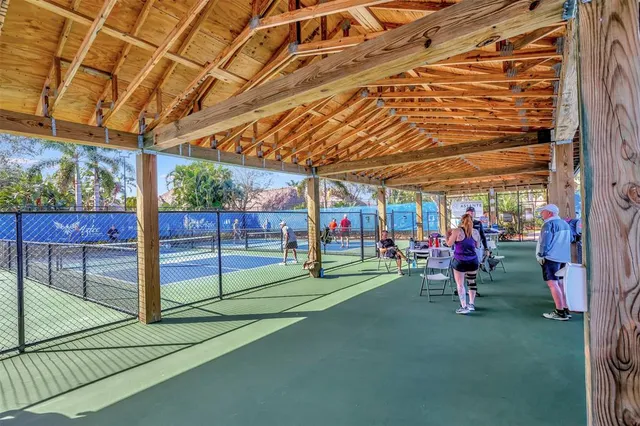 a view of a house with fountain and garden