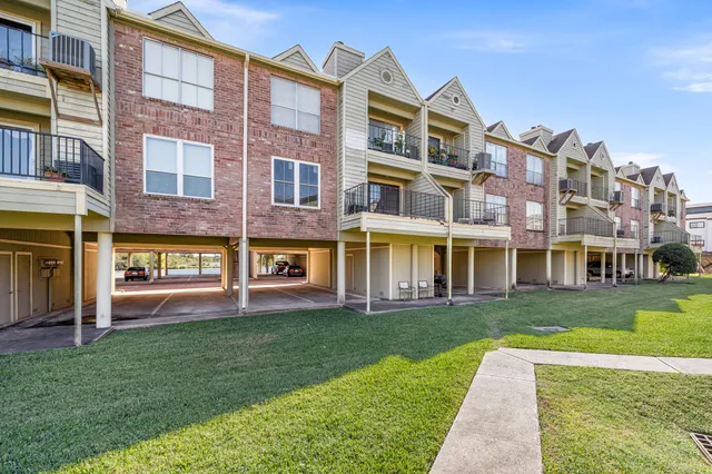 a view of a house with pool and chairs