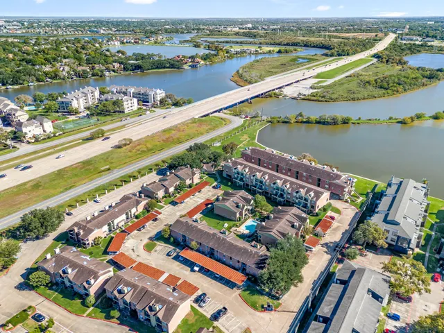 an aerial view of a city with a lake view