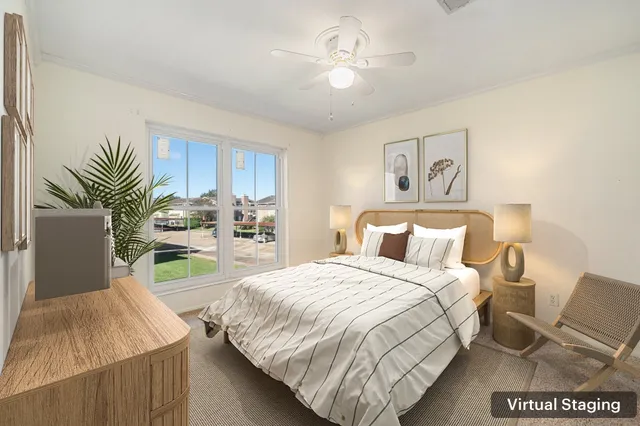 an empty room with closet and a chandelier fan