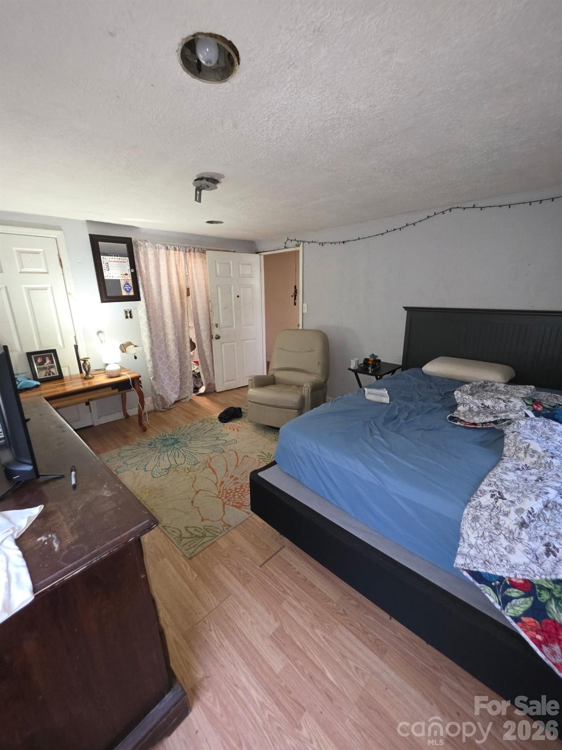 2927 Caney Creek Road Murphy, NC 28906 - Photo 16 of 22 a bedroom with a bed and wooden floor