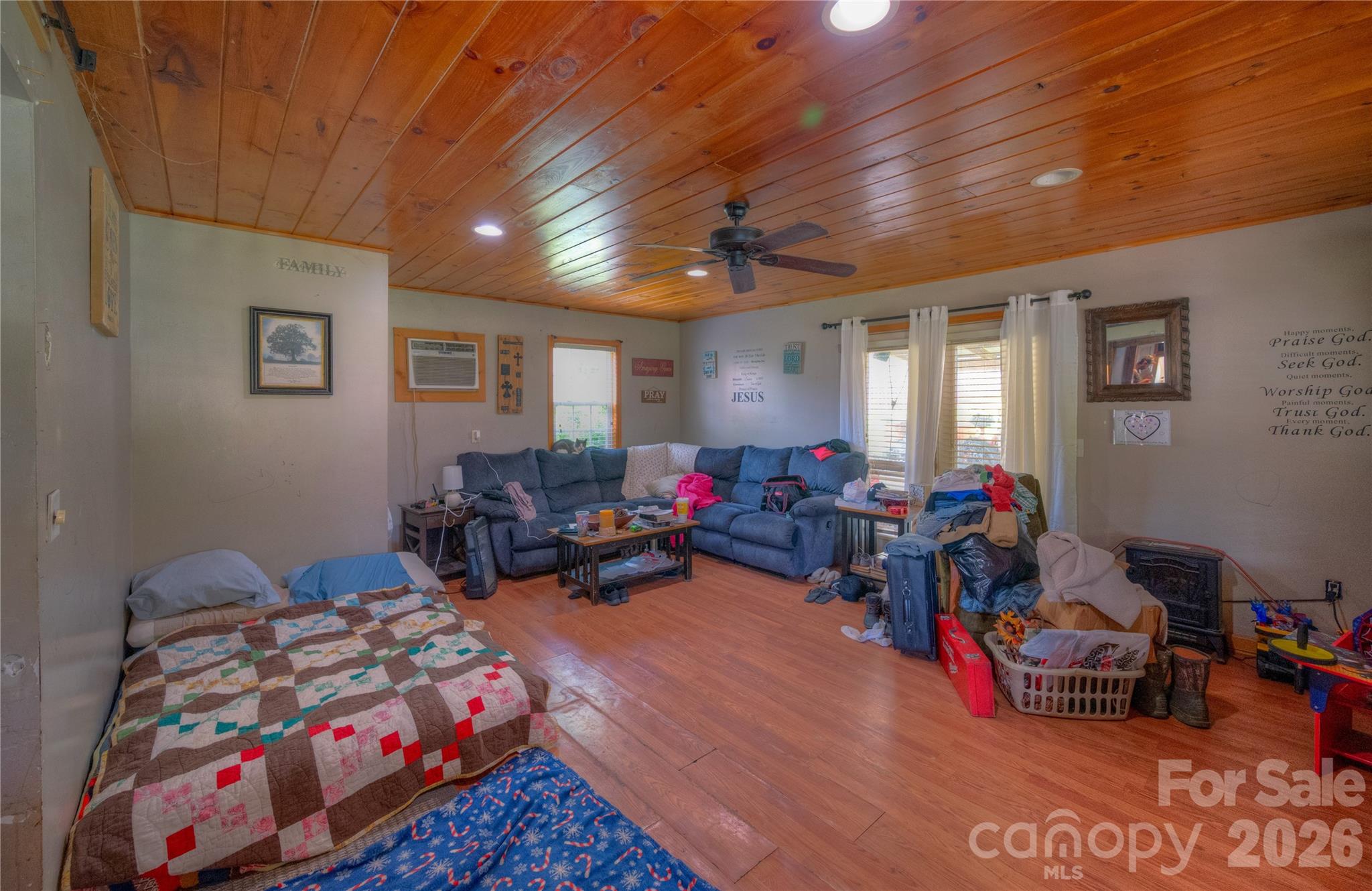 2927 Caney Creek Road Murphy, NC 28906 - Photo 18 of 22 a living room with lots of furniture and a bed