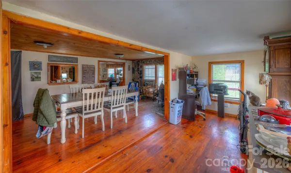 a living room with furniture and wooden floors