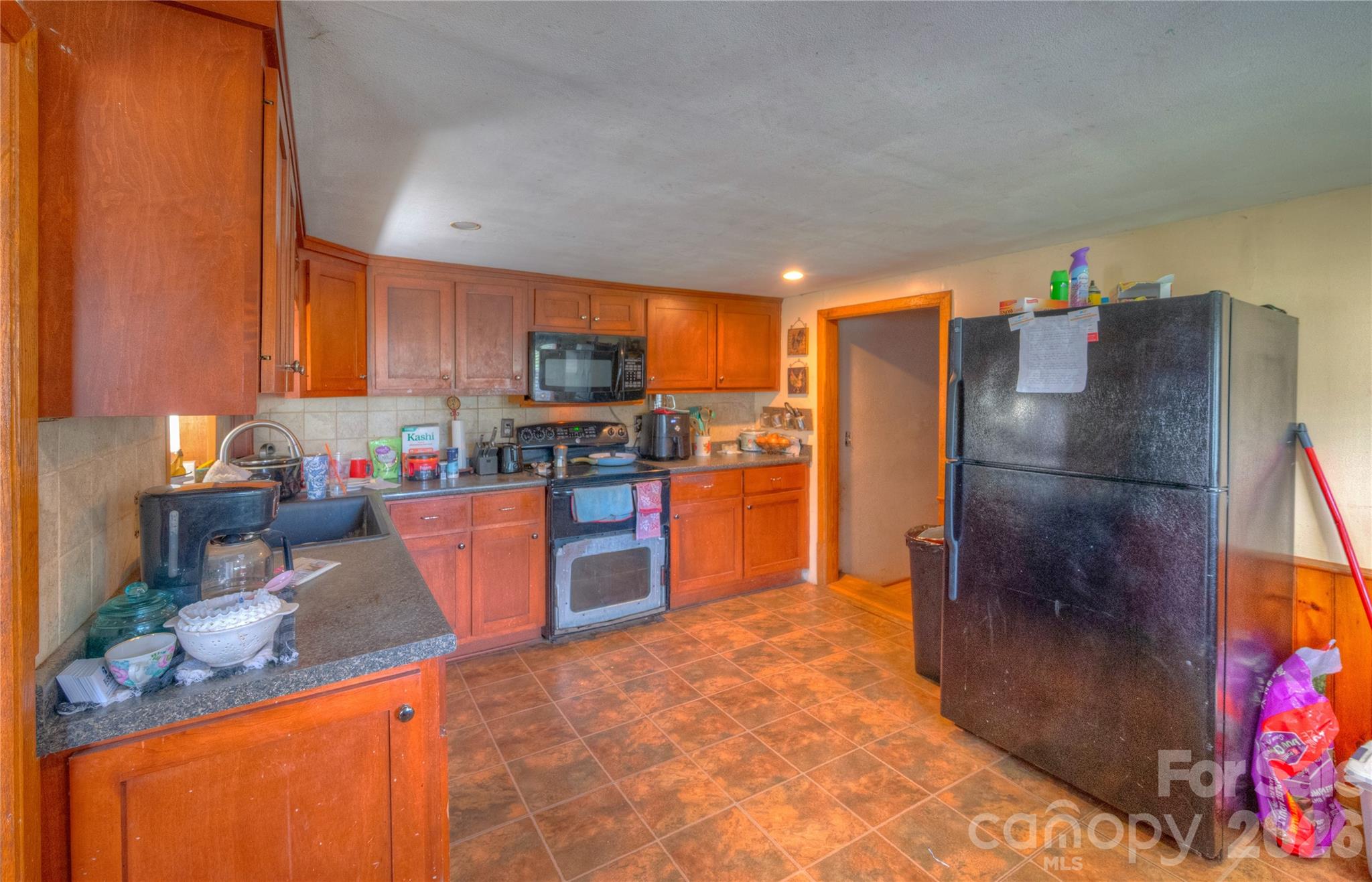 2927 Caney Creek Road Murphy, NC 28906 - Photo 10 of 22 a kitchen with stainless steel appliances granite countertop a refrigerator and a stove