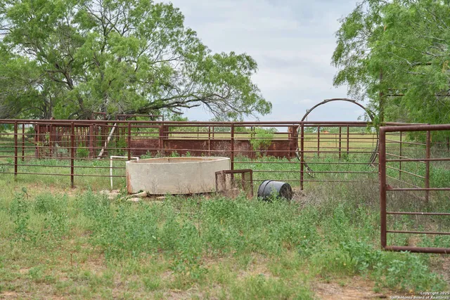 a view of a lake with houses in the back