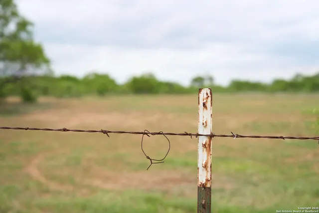 a backyard of a house with yard fire pit and outdoor seating