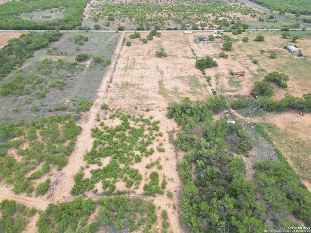 a view of backyard with green space