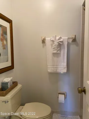 a bathroom with a toilet and a sink