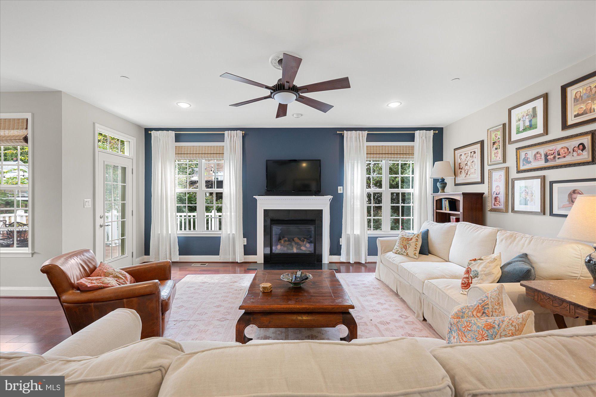 8808 Walnut Hill Road Chevy Chase, MD 20815 - Photo 12 of 60 a living room with furniture fireplace and a large window